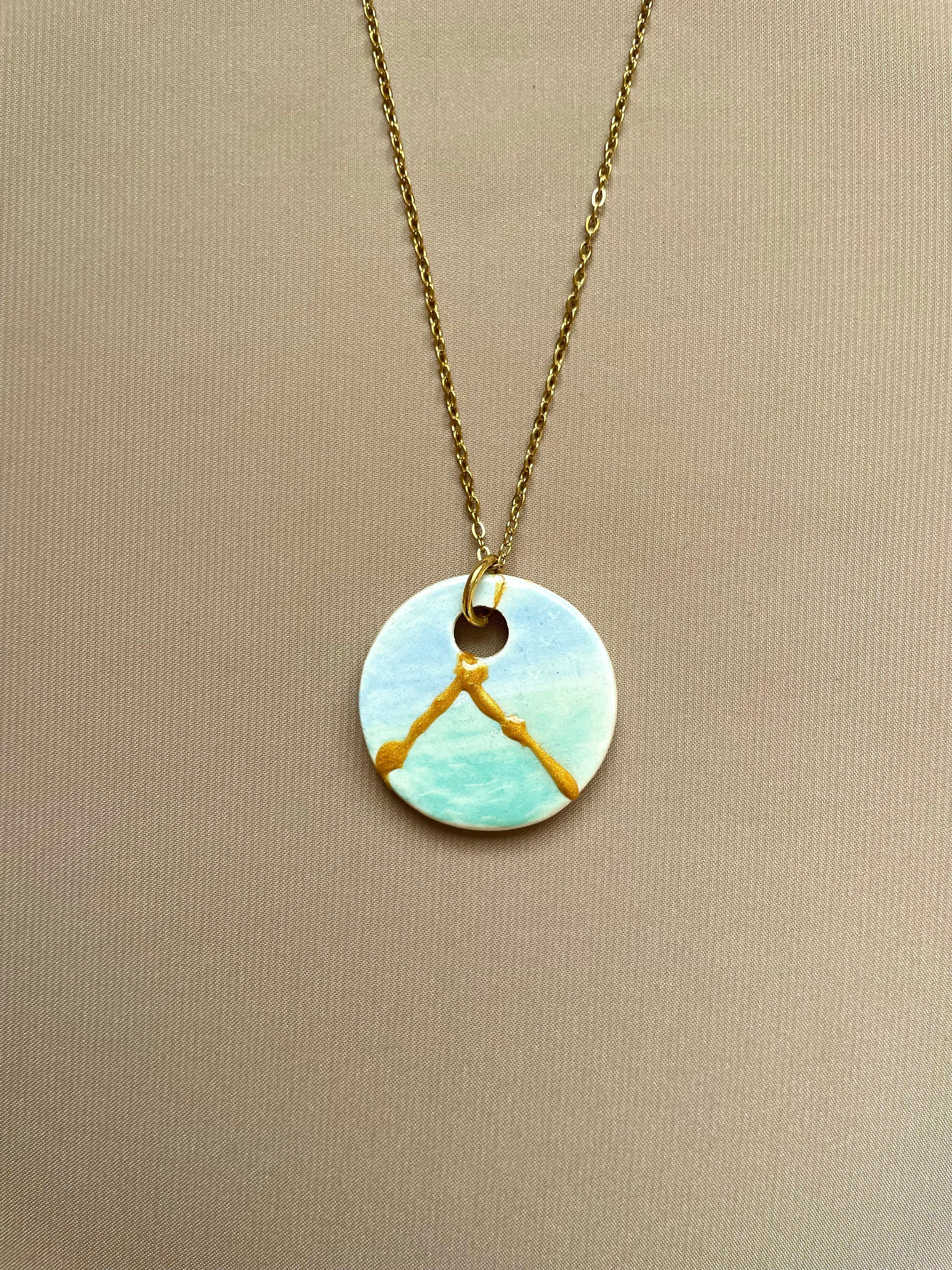 Colgante redondo de mar y cielo, con kintsugi